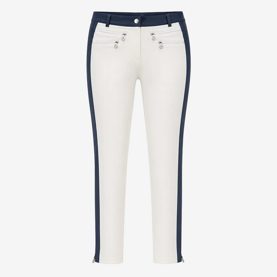 White cropped pants with navy blue side panels and silver-tone hardware details on the front pockets, shown against a plain white background.