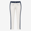White cropped pants with navy blue side panels and silver-tone hardware details on the front pockets, shown against a plain white background.