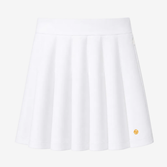 A white pleated athletic skirt with a small gold circular logo on the lower right hem, shown against a plain white background.