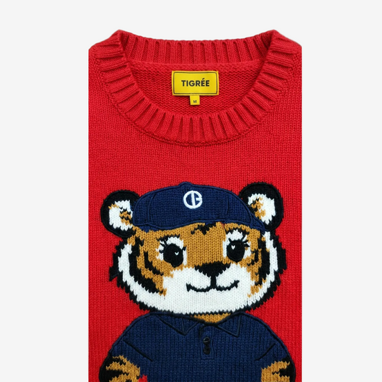 Red sweater with a tiger design and 'Tigree' label on a white background