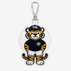 An embroidered tiger mascot keychain or bag charm on a white background. The character wears a navy blue jersey with a white 'H' logo, white shorts, and a navy cap with 'T26' in white.