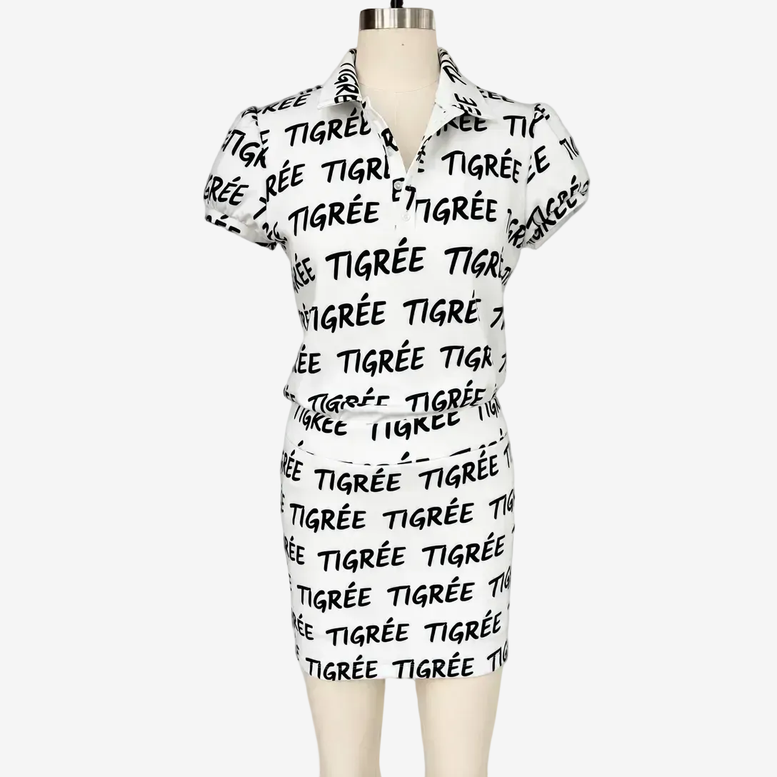 White dress with black text on a mannequin against a white background