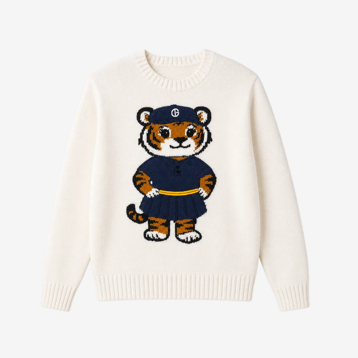 An off-white knit crewneck sweater featuring a central cartoon tiger graphic wearing a navy blue uniform with a yellow belt and a cap with a white monogram logo.