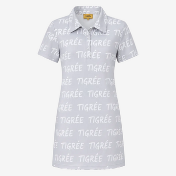 A short-sleeve polo shirt in white with an all-over light gray 'TIGRÉE' text pattern, featuring a classic collar and a three-button placket. A yellow 'THREE' brand label is visible inside the collar.