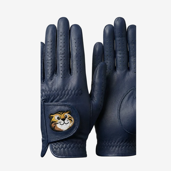 Pair of navy blue gloves with a cartoon character patch on a light gray background