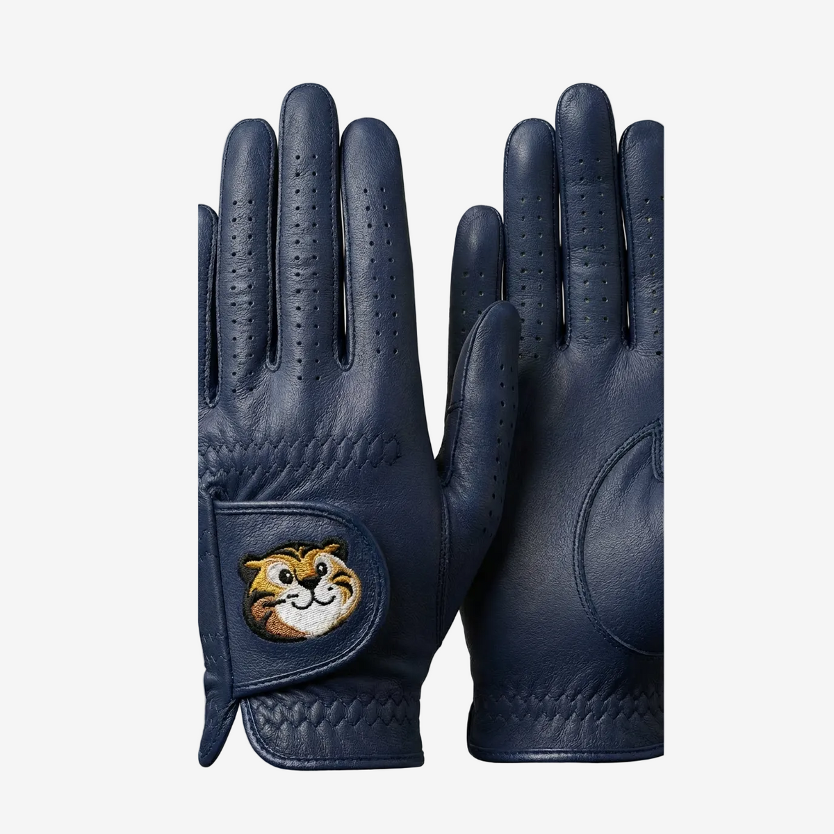 Pair of navy blue gloves with a cartoon character patch on a light gray background