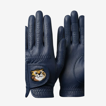 Pair of navy blue gloves with a cartoon character patch on a light gray background