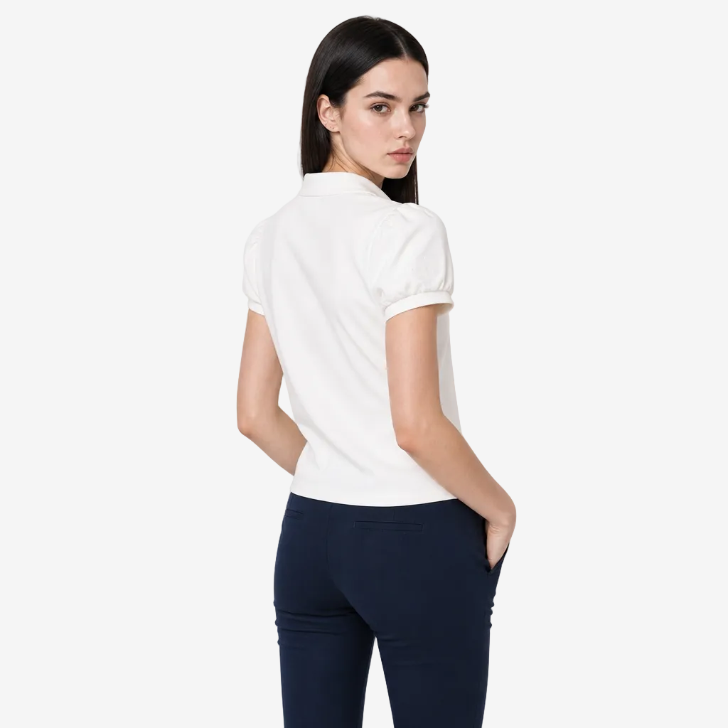 A woman modeling a white short-sleeve blouse with puffed sleeves, shown from the back against a plain light gray studio background.