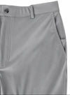 Close-up of light gray trousers showing the waistband with a button closure, belt loops, front seam, and side pocket.