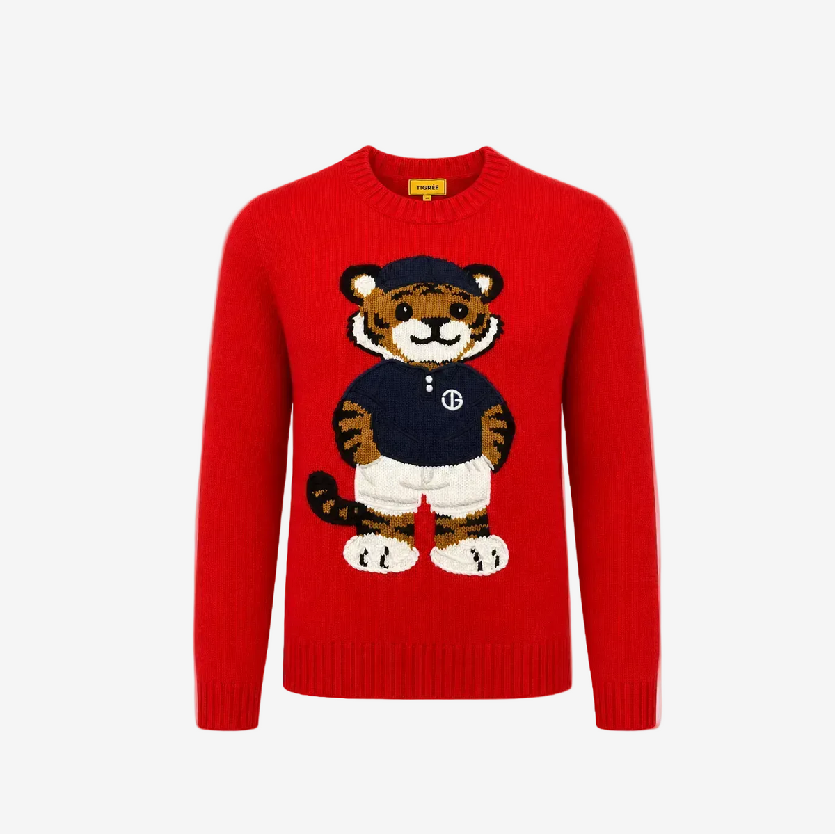 A bright red crewneck knit sweater featuring a large, detailed cartoon tiger graphic on the front. The tiger is wearing a navy blue shirt with a white 'B' logo, white shorts, and a navy blue cap.