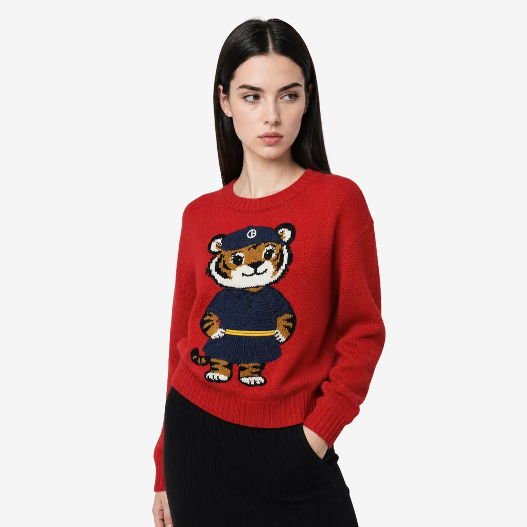 Woman wearing a red sweater with a tiger design on a white background