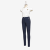 A mannequin wearing a white short-sleeve polo shirt with a small embroidered logo on the chest and navy blue fitted pants with a diagonal zip detail on the side, set against a plain white background.